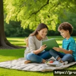 이색피크닉 친환경 돗자리 - A cozy family picnic scene set in a lush green park during spring, featuring an eco-friendly leisure...