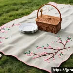 이색피크닉 자수로 만든 피크닉 세트 - A beautifully arranged picnic set featuring delicate hand embroidery with cherry blossom motifs on s...